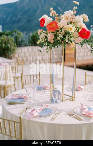 Elegant seaside wedding dinner setup in Montenegro Stock Photo