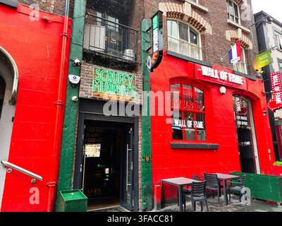 Liverpool, UK - May 16, 2026: Exterior of Scruffy Murphy's Irish American bar and neighboring Wall of Fame live music venue in Liverpool UK. Stock Photo