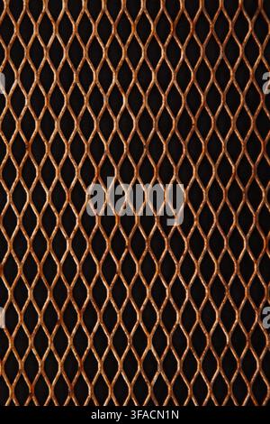 Rusty metallic diamond mesh grid background full frame texture. Stock Photo