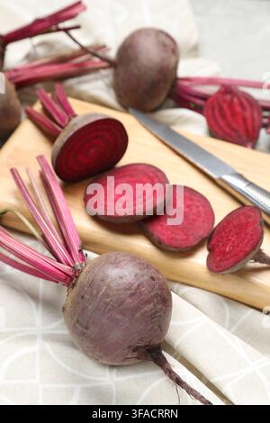 Fresh young beets and knife on table, closeup Stock Photo