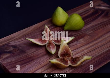 Fresh ripe figs whole and sliced for serving Stock Photo