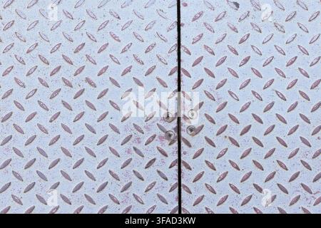 metallic diamond plate textured surface abstract texture background Stock Photo