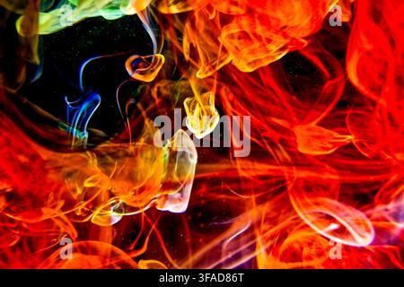 Swirling vibrant colours creating a dynamic abstract science inspired background with flowing energy and motion Stock Photo