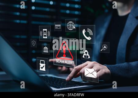 Scam alert warning. Cybersecurity concept. Woman using laptop and smartphone, warning sign for scams representing online threats, phishing, cybersecur Stock Photo
