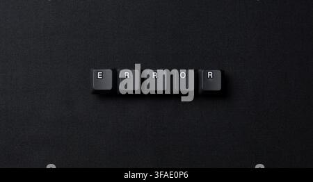 Error word made from keyboard keys on a dark textured surface, representing system failure, bug, troubleshooting, crash, and technology problems. Stock Photo