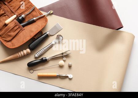 Leather crafting tools and materials, handmade goods and artisan workshop, hobby and creative leisure activity Stock Photo