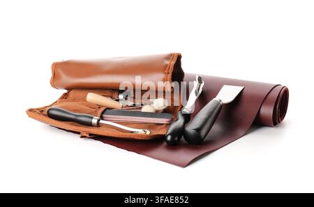 Leather crafting tools and supplies handmade leather goods artisan workshop equipment hobby and DIY projects on white background Stock Photo