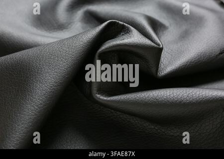 Black leather texture background luxury fashion material upholstery and garment industry concept abstract pattern with wrinkles and folds Stock Photo