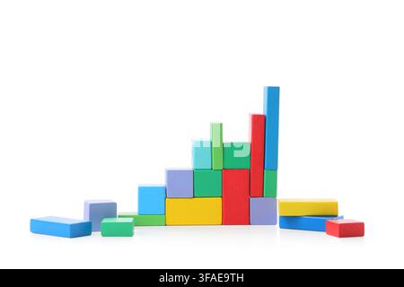 Business growth and financial success concept, colorful wooden building blocks arranged as a rising bar graph on white background Stock Photo