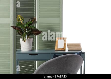 Home office and remote work setup modern desk with plant books and picture frame isolated on white background Stock Photo