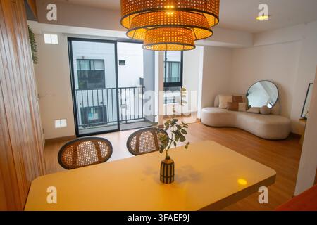 Modern Open-Concept Apartment Interior with Dining Area and Living Room Stock Photo