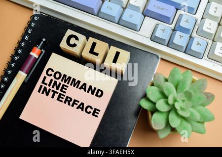 Concept of CLI - Command Line Interface write on sticky notes isolated on table. Stock Photo