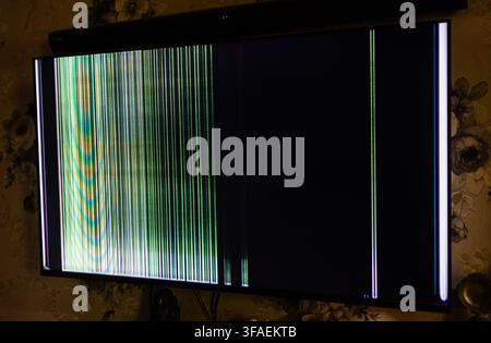 Television Screen With Vertical Colored Stripes Caused By Display Malfunction Stock Photo