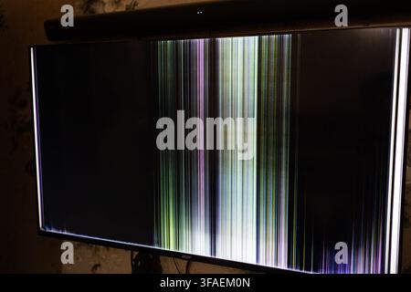 Damaged TV Screen Showing Vertical Colored Lines And Display Glitches Stock Photo