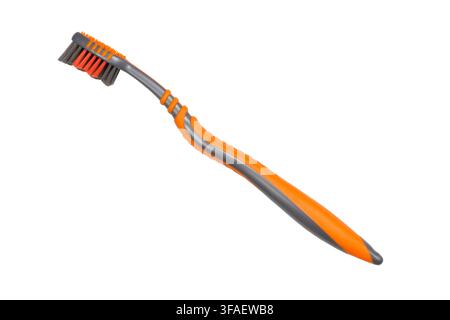 A modern toothbrush is isolated on a white background. New toothbrush close-up. Stock Photo