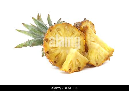 Fresh juicy pineapple slices displayed with the green crown on clean white background, evoking tropical summer flavor, healthy snacking and vibrant ye Stock Photo