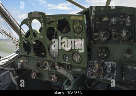 The worn instrument panel in an aircraft cockpit with several measuring instruments, cockpit and instrument panel of a PZL-104 Wilga multi-purpose air Stock Photo