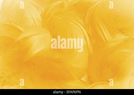 An abstract background featuring soft, blended shades of yellow. The texture appears smooth with flowing patterns, creating a warm and inviting atmosp Stock Photo