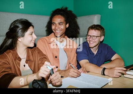 Diverse College Students Studying and Collaborating on Campus Stock Photo