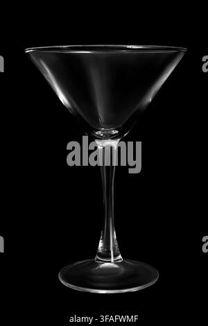 Empty martini glass isolated on black background Stock Photo