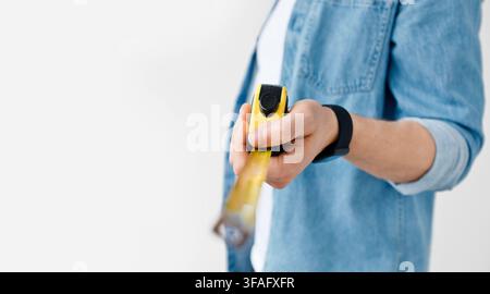 Carpenter, handyman, construction with tape-line and engineer size measuring for repair Stock Photo