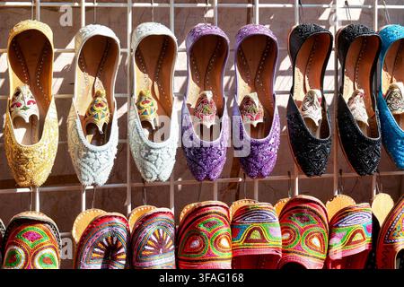 Close up of colorful embroidered traditional shoes for sale. Bur Dubai Souk, Dubai, UAE. Stock Photo