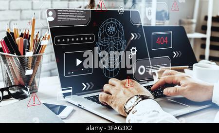 Deep fake technology displayed on a laptop with data graphics in an office setting Stock Photo
