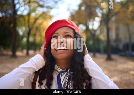 Woman smiling in an autumn forest. Stock Photo
