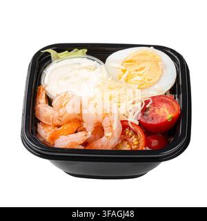 Caesar salad with shrimp and sauce box isolated Stock Photo