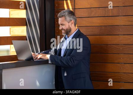 Business success. Man checking email. Successful businessman freelancing online. Businessman freelancing online. Freelancer developer do business Stock Photo