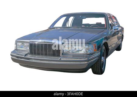 Classic car sedan on white background, sleek green finish, elegant grille design, glossy exterior, dark interior, premium look, professional photograp Stock Photo