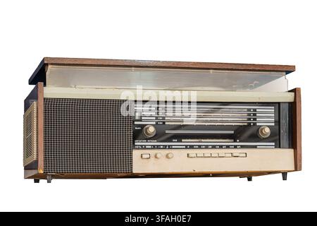 Vintage radio isolated on white background, featuring rectangular beige and dark brown design, grid-like speaker grille, control panel with multiple d Stock Photo
