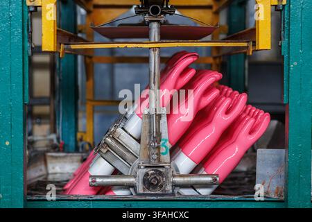 rubber gloves production process. High quality photo Stock Photo