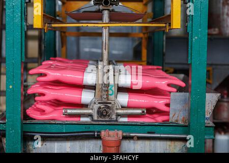 rubber gloves production process. High quality photo Stock Photo