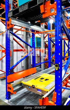 Automated pallet shuttle system running on steel racks in modern smart warehouse facility Stock Photo
