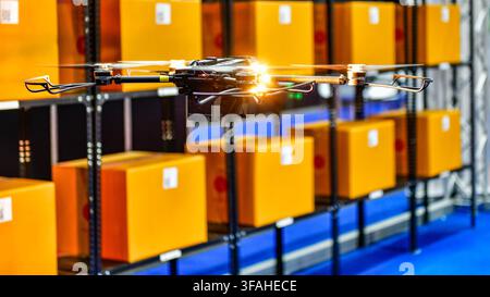 Autonomous drone flying inside modern warehouse for inventory scanning and smart logistics technology Stock Photo