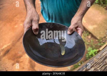 Detail of the gold sparkling gold prospector's pool - handcrafted golden gold mining community - Vila Ressaca - Grand Tour of the Xingu Stock Photo