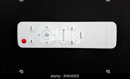White LED Light Remote Control with Dimmable Lighting Buttons Stock Photo