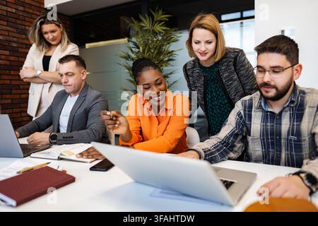 Diverse business team collaborating and working together in office Stock Photo