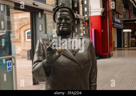 Bronze statue of politician Bessie Braddock holding an egg at Liverpool Lime Street railway station in Liverpool, UK. Stock Photo