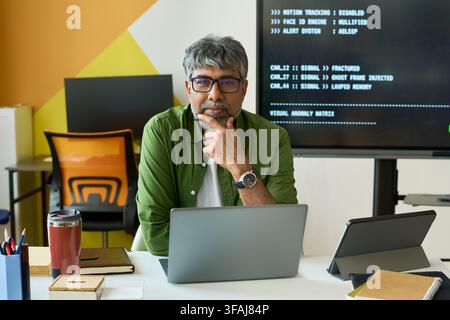 Portrait of Middle Aged Indian IT Specialist Working as School Teacher Stock Photo
