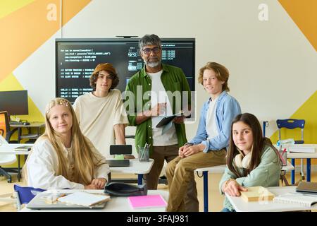 Portrait of Indian Teacher and Teenagers in Coding Class Stock Photo