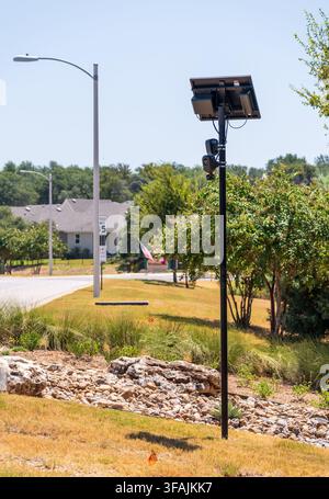Solar powered automatic license plate reader camera installed on a suburban street pole for traffic monitoring near Georgetown Texas Stock Photo