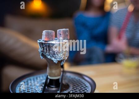 Close-up of burning charcoal cubes on a hookah bowl Stock Photo