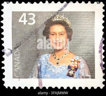 Vintage Canadian postage stamp from 1988 featuring Queen Elizabeth II in formal royal tiara and jewels with 43 cents denomination value Stock Photo