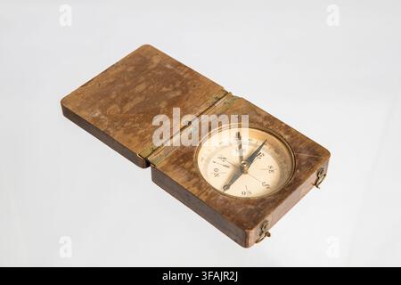 Antique Compass Isolated on White Background, Vintage Navigation Instrument Representing Exploration, Travel, Adventure and Discovery Stock Photo