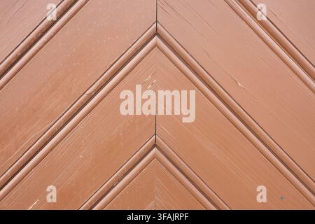 Brown wooden door chevron pattern texture background. Stock Photo