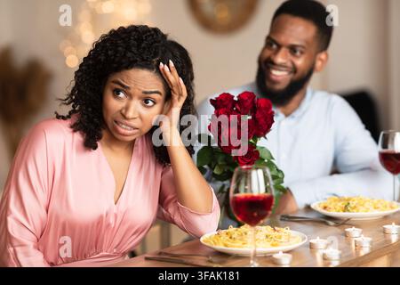 Black Woman On Unsuccessful First Date In Restaurant Stock Photo