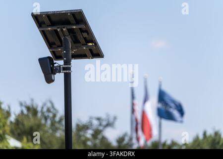 Solar powered automatic license plate reader camera installed on a suburban street pole for traffic monitoring near Georgetown Texas Stock Photo