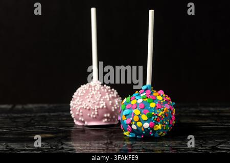 Close-Up of Colorful Cake Pops on a Dark Background Stock Photo
